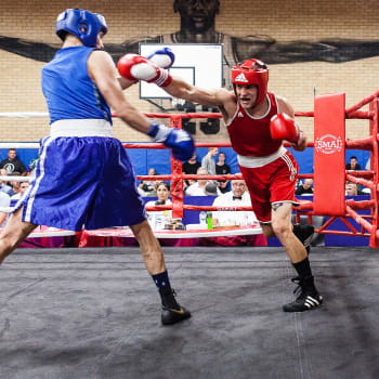 Two men sparring in a boxing match