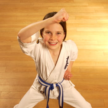 young girl in a defensive posture